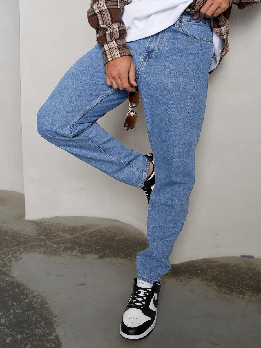 Джинсы бананы зауженные к низу мом